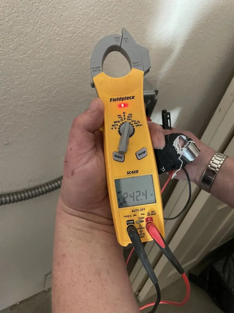 Voltage testing with clamp meter during Recessed Lighting Installation in Scituate